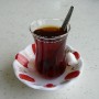 Traditional Turkish tea offered by the manager of the truckstop